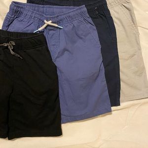 A group of cat&jack brand kids shorts.  4 shorts total, 3 of them Athletic Style